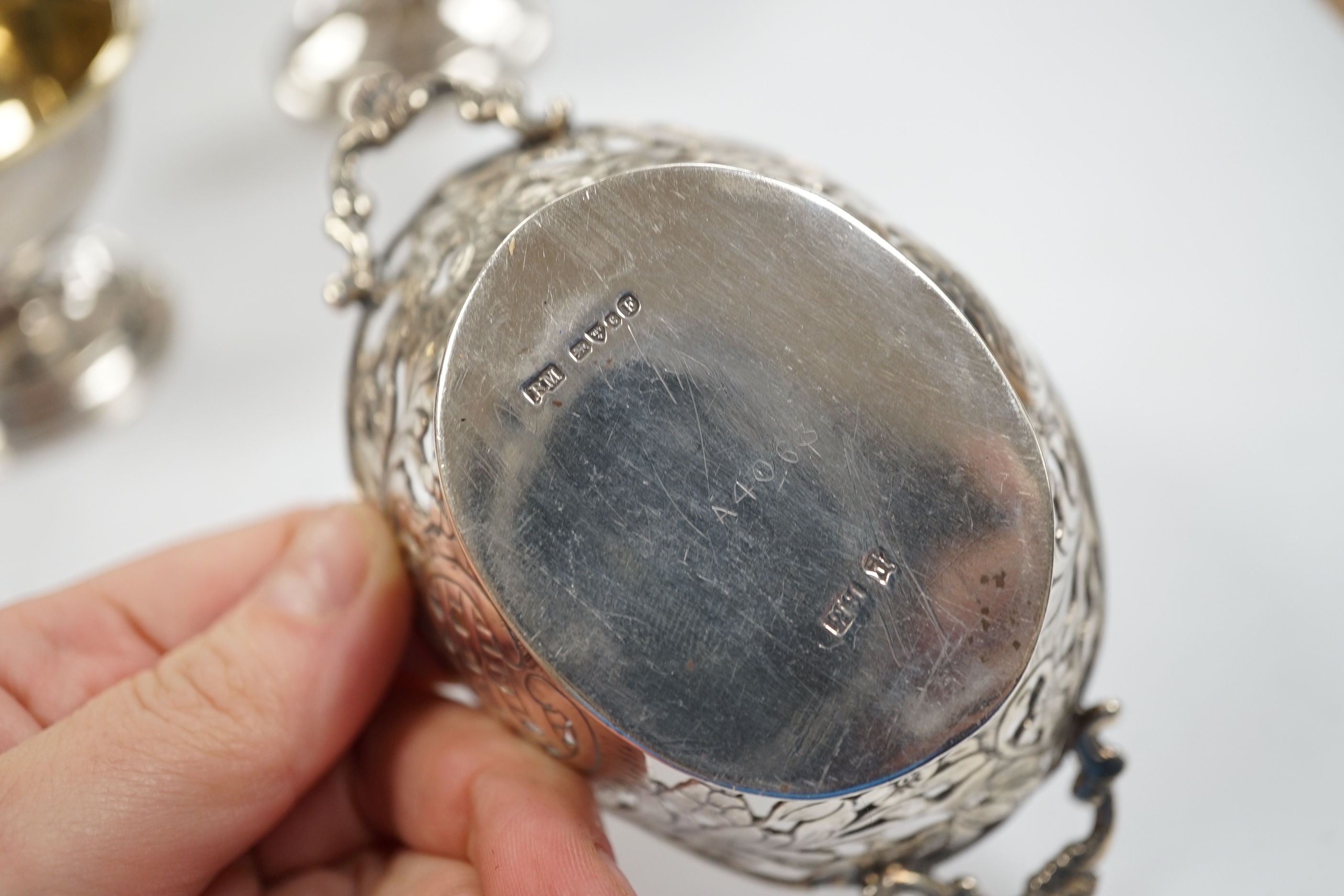A pair of George III silver circular pedestal salts, John Kidder?, London, 1799, diameter 78mm and a small Hanau silver two handled dish.